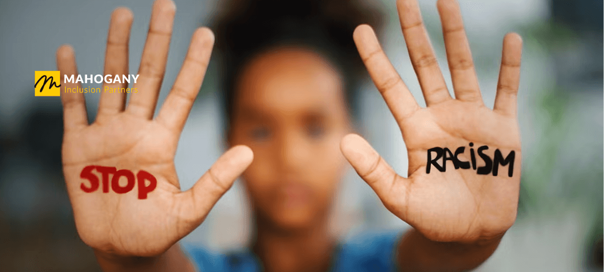 Hands with the words stop racism
